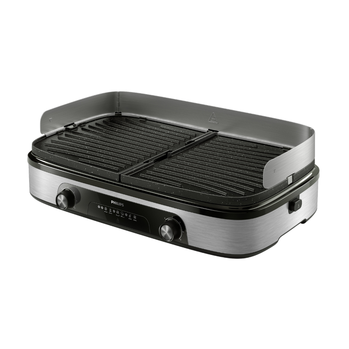Disfruta de los deliciosos sabores de la parrilla en casa con la plancha-parrilla de Philips. Gracias a sus dos zonas de calentamiento y a sus placas reversibles, podr&aacute;s disfrutar de una cocina vers&aacute;til y de unos resultados perfectos. 
Philips HD6222/90 Plancha-Parrilla con 2 zonas de calentamiento independientes, placas reversibles y temperatura ajustable. Gran superficie de 1400 cm&sup2;, 2400 W de potencia, bandeja recogegrasas desmontable y revestimiento de piedra Maifan para un asado vers&aacute;til, r&aacute;pido y limpio.