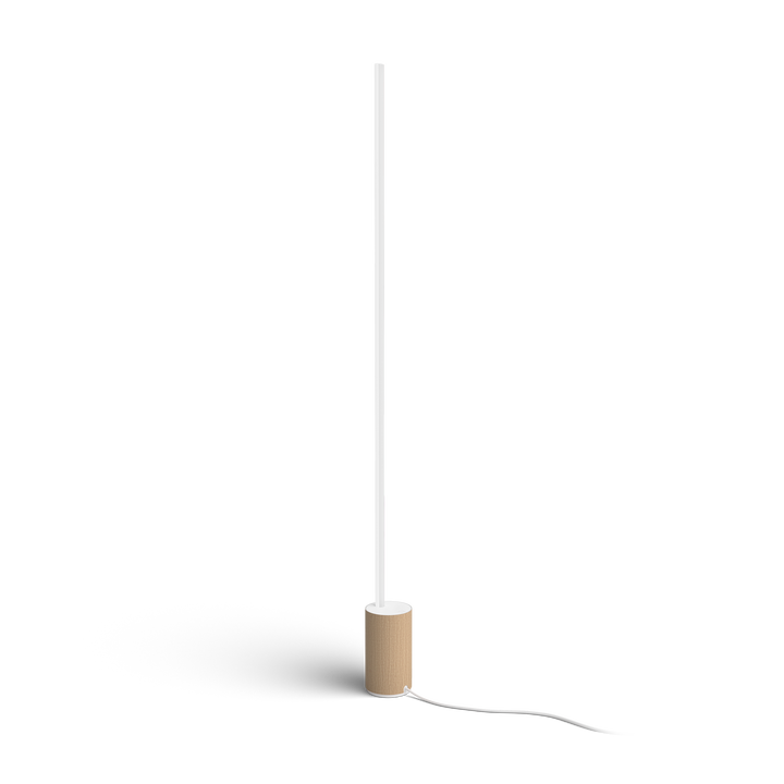 <p>L&aacute;mpara de Pie HUE Signe Gradient</p>
<p>LED integrado.</p>
<p>Bombilla incluida.</p>
<p>Controlable por Wifi &amp; Bluetooth.</p>
<p>Despi&eacute;rtate con el sol matinal, programado para que salga a tu conveniencia. Con una base en tonos de madera, un dise&ntilde;o delgado y una combinaci&oacute;n brillante de luz colorida, esta l&aacute;mpara de pie es tanto una pieza llamativa como un acento sutil para tu dormitorio.</p>
<ul style="list-style-type: circle;">
<li><strong>Bombillas Compatibles:&nbsp;</strong>LED Integrado.</li>
<li><strong>Casquillo:&nbsp;</strong>Integrado</li>
<li><strong>Bombilla incluida:&nbsp;</strong>SI</li>
<li><strong>N&ordm; Bombillas:</strong>&nbsp;1</li>
<li><strong>Regulable:</strong>&nbsp;SI</li>
<li><strong>Luminosidad (LM):</strong>&nbsp;2550 lm</li>
<li><strong>Bridge incluido:</strong>&nbsp;NO</li>
<li><strong>Di&aacute;metro (mm):</strong>&nbsp;111</li>
<li><strong>Altura (mm):</strong>&nbsp;1458</li>
<li><strong>Material:&nbsp;</strong>Metal y Sint&eacute;tico</li>
<li><strong>Color:</strong>&nbsp;Blanco y Madera Haya</li>
<li><strong>Protecci&oacute;n IP:</strong>&nbsp;IP20</li>
</ul>