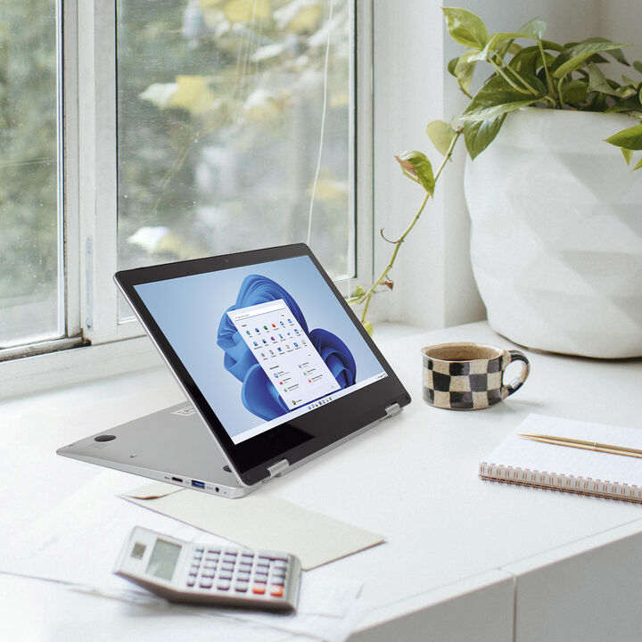 <p>El ordenador port&aacute;til convertible Flex Pro ofrece todas las herramientas necesarias para realizar tus tareas, teletrabajar, o recibir clases online. Su dise&ntilde;o fino y ligero te permite llevarlo siempre contigo de forma c&oacute;moda. Adem&aacute;s, gracias a su dise&ntilde;o con pantalla giratoria 360&ordm;, podr&aacute;s transformar tu ordenador en tablet seg&uacute;n tus necesidades.</p>

<p><b><u>Caracter&iacute;sticas:</u></b></p>
<ul>
<p><li><b>Ordenador profesional.</b> El port&aacute;til posee Sistema Operativo profesional Windows 11 Home y procesador Intel Celeron N4020.</li></p>
<p><li><b>Pantalla.</b> Dispone de una pantalla t&aacute;ctil giratoria de 11,6&rdquo; con una resoluci&oacute;n HD de 1366&times;768. Obtendr&aacute;s un brillo, contraste, color y gr&aacute;ficos de calidad.</li></p>
<p><li><b>Capacidad de memoria.</b> Posee 4 GB de memoria RAM y 128 GB de memoria interna. Adem&aacute;s, soporta discos externos SSD de hasta 512 GB.</li></p>
<p><li><b>Paquete Office.</b> Gracias al paquete Office integrado, tendr&aacute;s acceso a m&uacute;ltiples herramientas como Word, Excel, PowerPoint, OneNote, Outlook, OneDrive y To Do de manera online.</li></p>
<p><li><b>Conectividad.</b> Posee conexi&oacute;n WiFi y Bluetooth. Adem&aacute;s, cuenta con entrada Jack 3.5mm para auriculares, USB 3.0, USB 2.0 y Mini HDMI para poder conectar tus dispositivos.</li></p>
<p><li><b>Bater&iacute;a de larga duraci&oacute;n.</b> Cuenta con una bater&iacute;a de 7.4V/4.000 mAh que proporciona largas horas de autonom&iacute;a.</li></p>
<p><li><b>C&aacute;mara.</b> El ordenador incorpora una c&aacute;mara frontal de 2 megap&iacute;xeles que permite realizar videollamadas con mayor calidad.</li></p>
</ul>

<p><b><u>Especificaciones t&eacute;cnicas:</u></b></p>
<ul>
<li>Sistema operativo Windows 11 Home S mode (64 bit)</li>
<li>Procesador Intel Celeron Gemini Lake N4020 1.10 Ghz - 2.80 Ghz</li>
<li>Memoria RAM 4 GB (DDR4)</li>
<li>Memoria interna 128 GB</li>
<li>Memoria ampliable por MicroSD hasta 128 GB</li>
<li>Soporta memoria externa SSD M.2 SAT hasta 512 GB</li>
<li>Pantalla LCD t&aacute;ctil 11.6&rdquo;. Resoluci&oacute;n 1366 x 768 p&iacute;xeles. Unidad gr&aacute;fica Intel HD Graphics 500</li>
<li>Conexi&oacute;n WiFi IEEE802.11 b/g/n y Bluetooth 4.0</li>
<li>Entrada USB 3.0, USB 2.0, Mini HDMI</li>
<li>Salida de audio Jack 3.5 mm para auriculares</li>
<li>Bater&iacute;a litio 4.000 mAh / 7.4 V</li>
<li>2 altavoces</li>
<li>C&aacute;mara delantera de 2 Mpx</li>
<li>Dimensiones: 28 x 19 x 1.6 cm</li>
</ul>