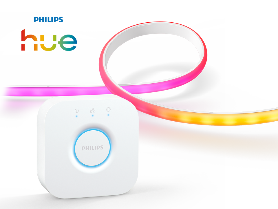 El pack incluye una tira de luces Philips Hue Gradient de 2 metros, perfecta para resaltar tu televisor, una estantería o cualquier mueble. Esta tira LED de vanguardia es capaz de proyectar múltiples colores a la vez, creando un efecto de degradado de color suave y dinámico que hará que tu espacio cobre vida.

Además, se incluye el Philips Hue Bridge, el cerebro del sistema. Con él, podrás controlar hasta 50 luces desde tu teléfono, sincronizarlas con tus películas y música, y crear rutinas personalizadas. Es el dúo perfecto para una experiencia de iluminación inteligente completa y envolvente.