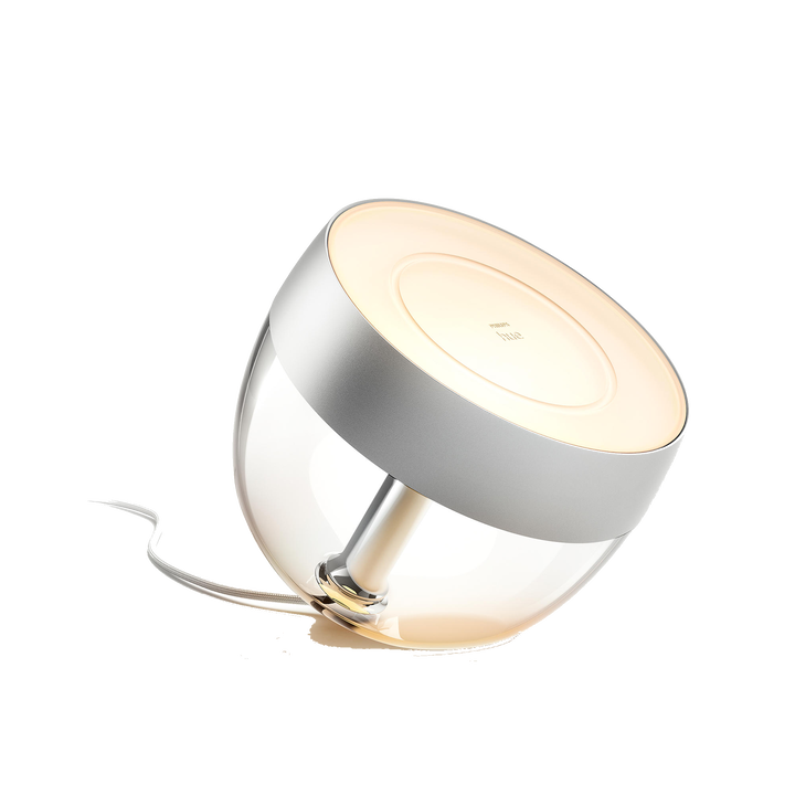 <p>L&aacute;mpara de Sobremesa HUE Iris.</p>
<p>LED integrado RGB.</p>
<p>Bombilla incluida.</p>
<p>Bridge NO incluido.</p>
<p>Define el ambiente que quieras en cualquier habitaci&oacute;n de tu hogar con la elegante l&aacute;mpara Philips Hue Iris en color blanco. La l&aacute;mpara Iris, con una luz que inunda la pared con color y ofrece una suave retroiluminaci&oacute;n, aporta un efecto sofisticado y &uacute;nico. A&ntilde;ade un Philips Hue Bridge para disfrutar de toda una variedad de funciones de iluminaci&oacute;n inteligente.</p>
<ul style="list-style-type: circle;">
<li><strong>Bombillas Compatibles:&nbsp;</strong>LED Integrado.</li>
<li><strong>Casquillo:&nbsp;</strong>Integrado</li>
<li><strong>Bombilla incluida:&nbsp;</strong>SI</li>
<li><strong>N&ordm; Bombillas:</strong>&nbsp;1 x 10w</li>
<li><strong>Regulable:</strong>&nbsp;SI</li>
<li><strong>Cambio de Color (PowerLED):</strong>&nbsp;SI</li>
<li><strong>Bridge incluido:</strong>&nbsp;NO</li>
<li><strong>Di&aacute;metro (mm):&nbsp;</strong>222</li>
<li><strong>Altura (mm):&nbsp;</strong>165</li>
<li><strong>Ancho (mm):</strong>&nbsp;150</li>
<li><strong>Material:&nbsp;</strong>Sint&eacute;tico</li>
<li><strong>Color:</strong>&nbsp;Claro</li>
<li><strong>Protecci&oacute;n IP:</strong>&nbsp;IP20</li>
<li><strong>Disponible en otros colores:</strong>&nbsp;NO</li>
</ul>